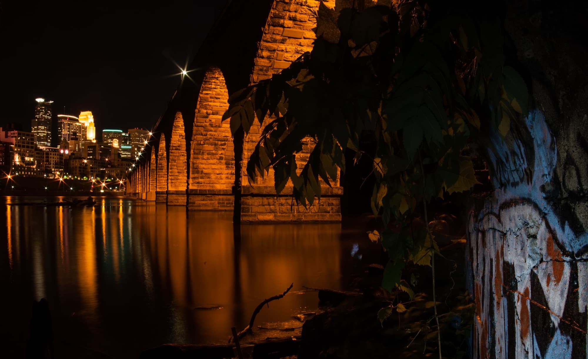 The Stone Arch Bridge and Minneapolis skyline at night
