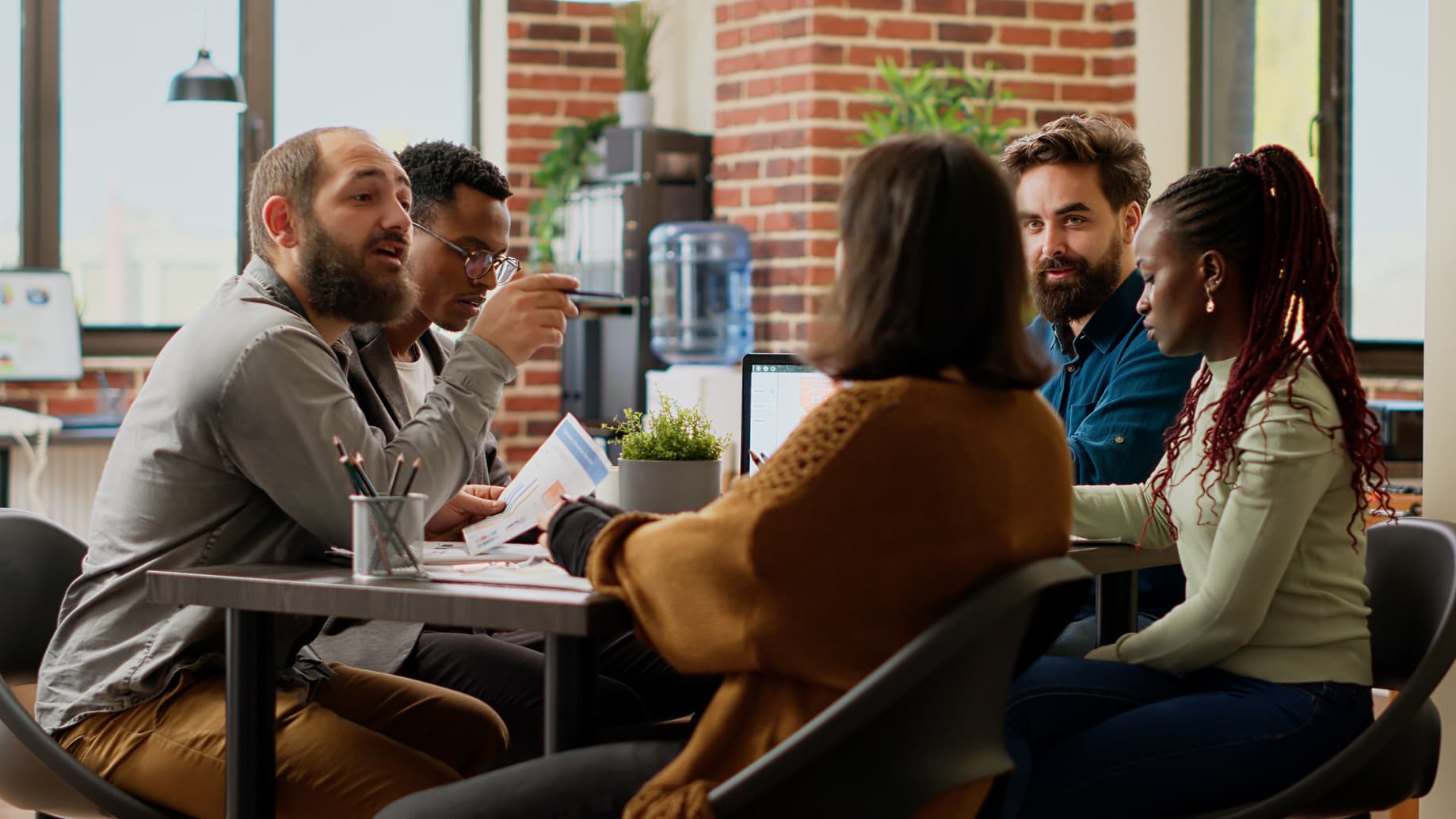 A small team reviewing a project together